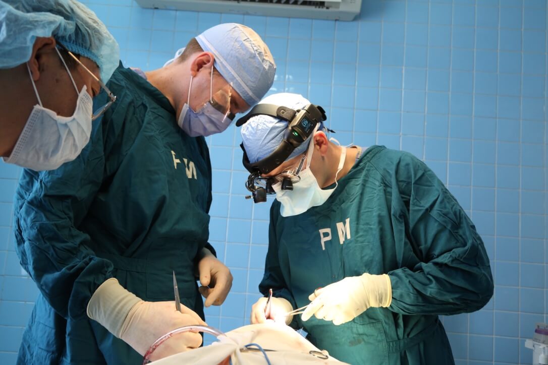 Dentists performing an operation during their trip to Vietnam.
